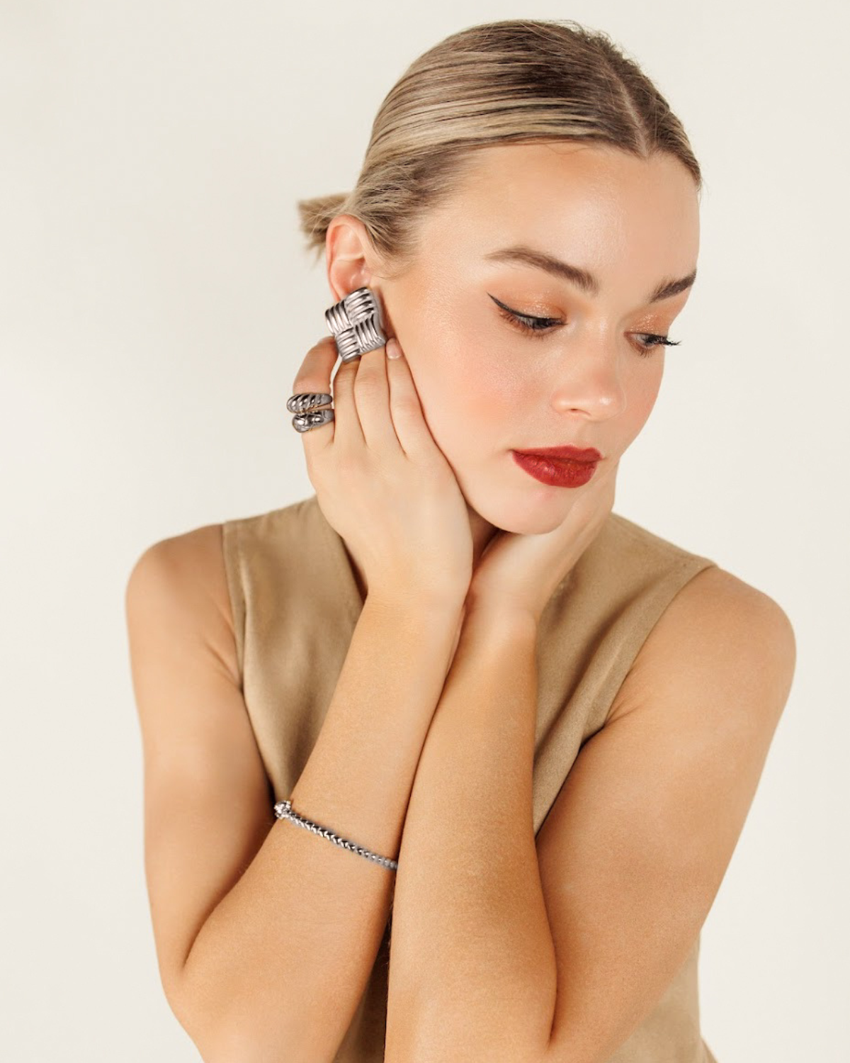 Side profile of model showcasing the Asha silver earrings as bold, everyday statement pieces.