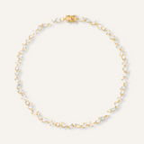 Carina Necklace featuring gold coating and various cut zirconia stones.