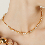 Closeup of Carina Necklace worn, showcasing its sparkling zirconia detail.