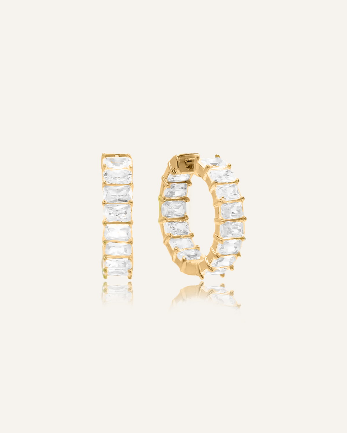 Claire Earrings in 18K gold, square-shaped huggie hoops with front-facing cubic zirconia stones.