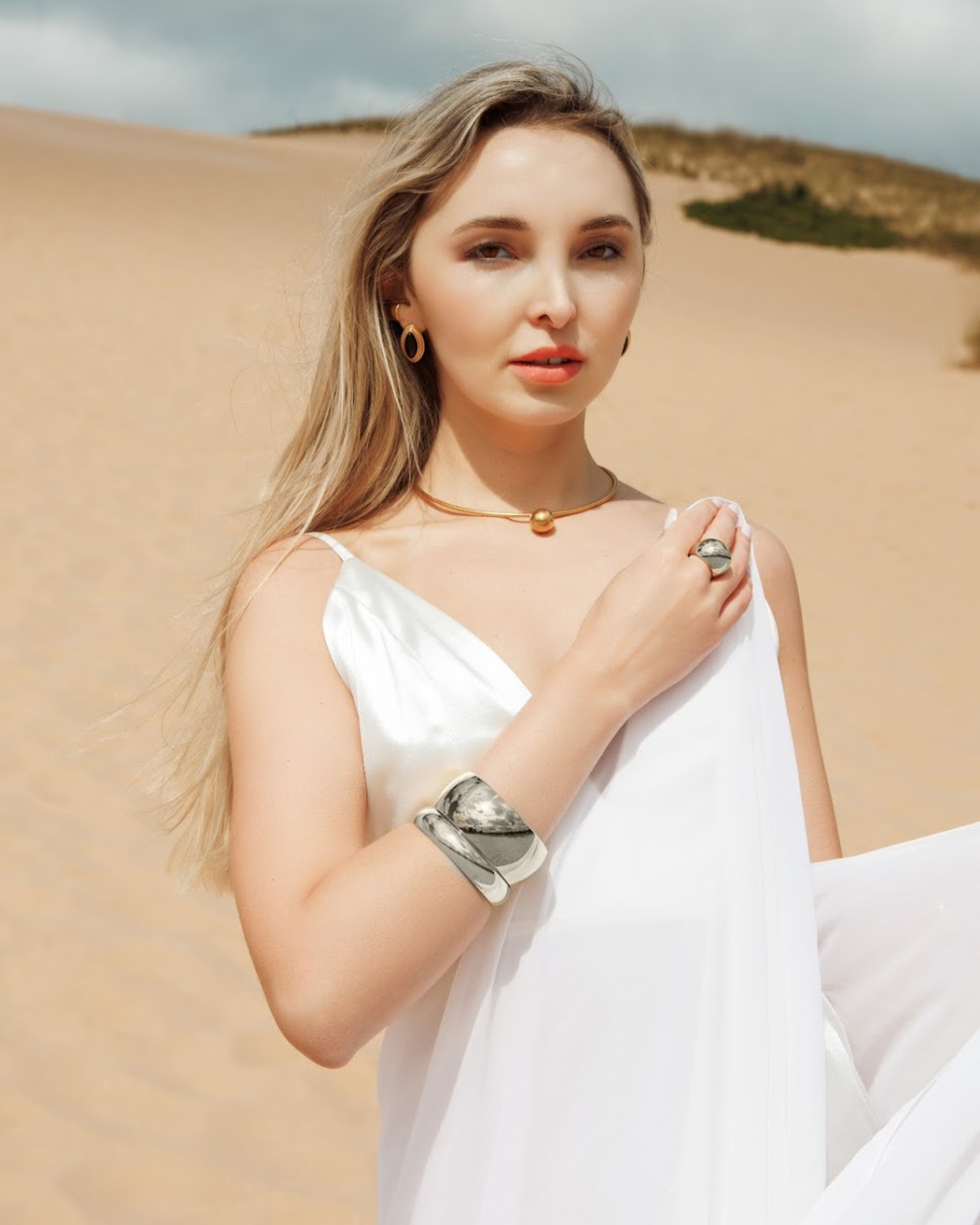 Kali Silver Cuff on model’s wrist, styled with a neutral-toned outfit.