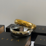 Kali Cuffs in silver and gold stacked together on VIEA Jewelry packaging.