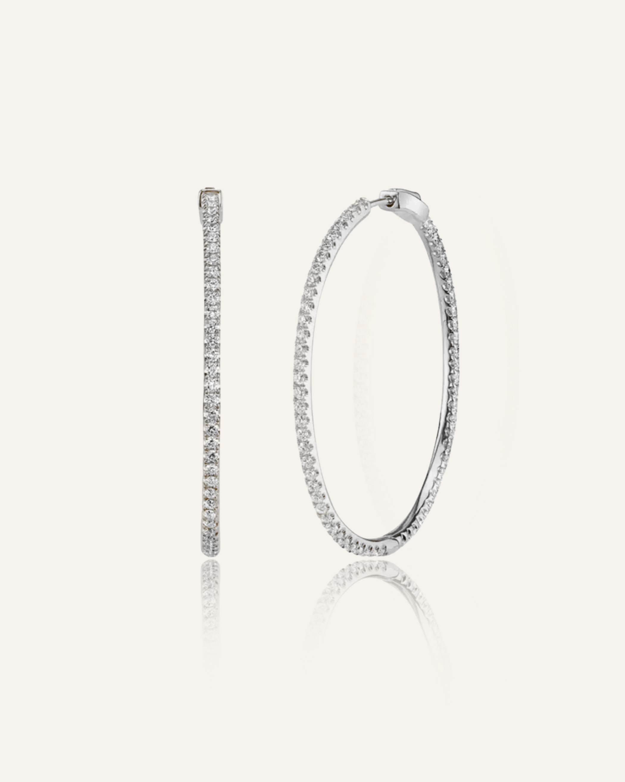 Lana silver hoop earrings with zirconia detail and huggie closure.