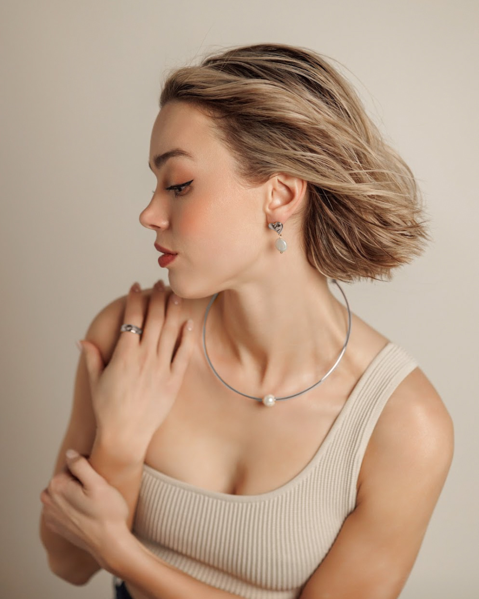 Lifestyle image of model in swimwear wearing Loreli Choker, styled for casual elegance.