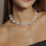 Close-up of the Margaret Necklace worn on neck, highlighting pearl and gold detail.