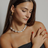 Woman wearing Margaret Necklace, styled as a statement pearl necklace.