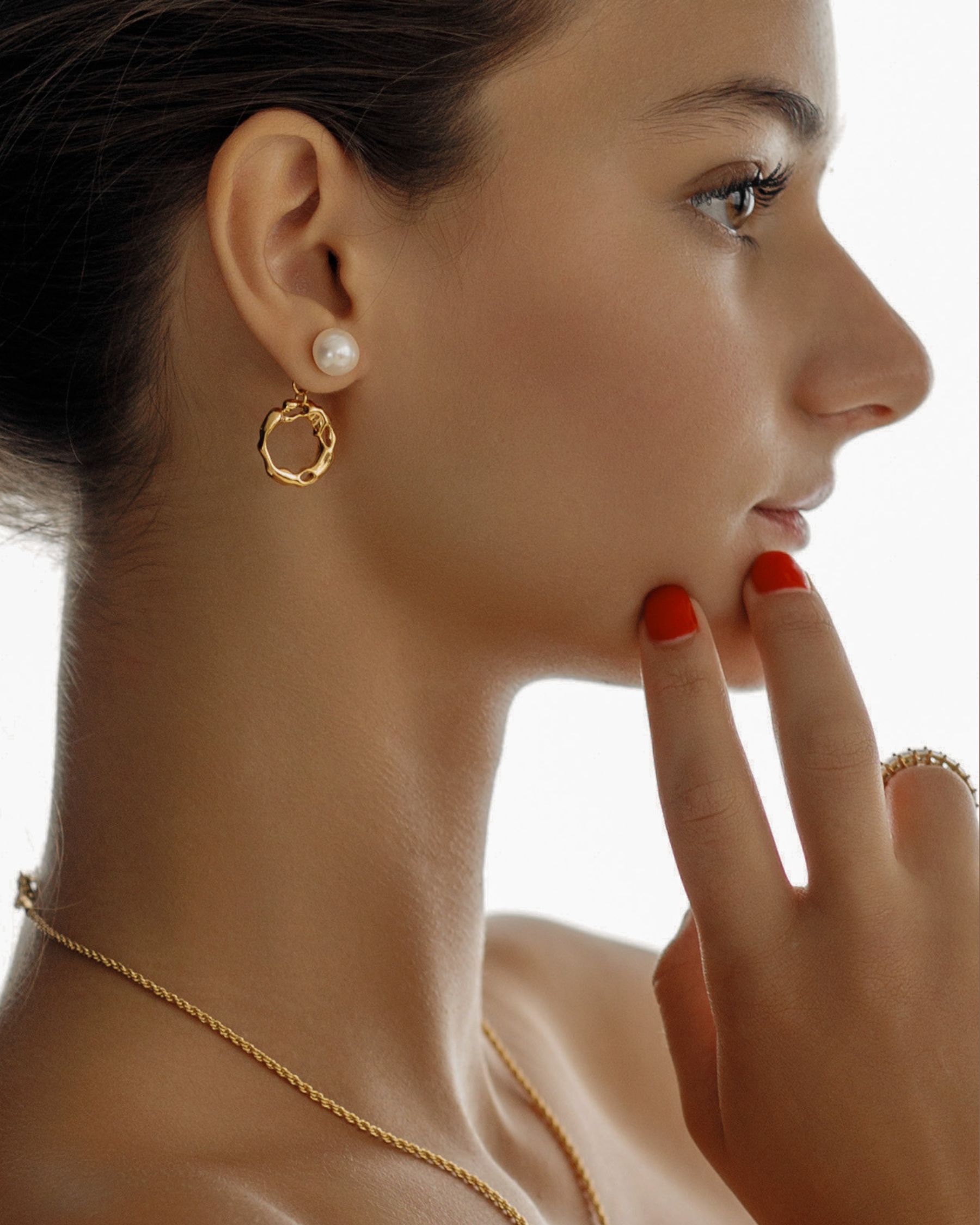 Maria Earrings shown from the side on model, showcasing dangle style.
