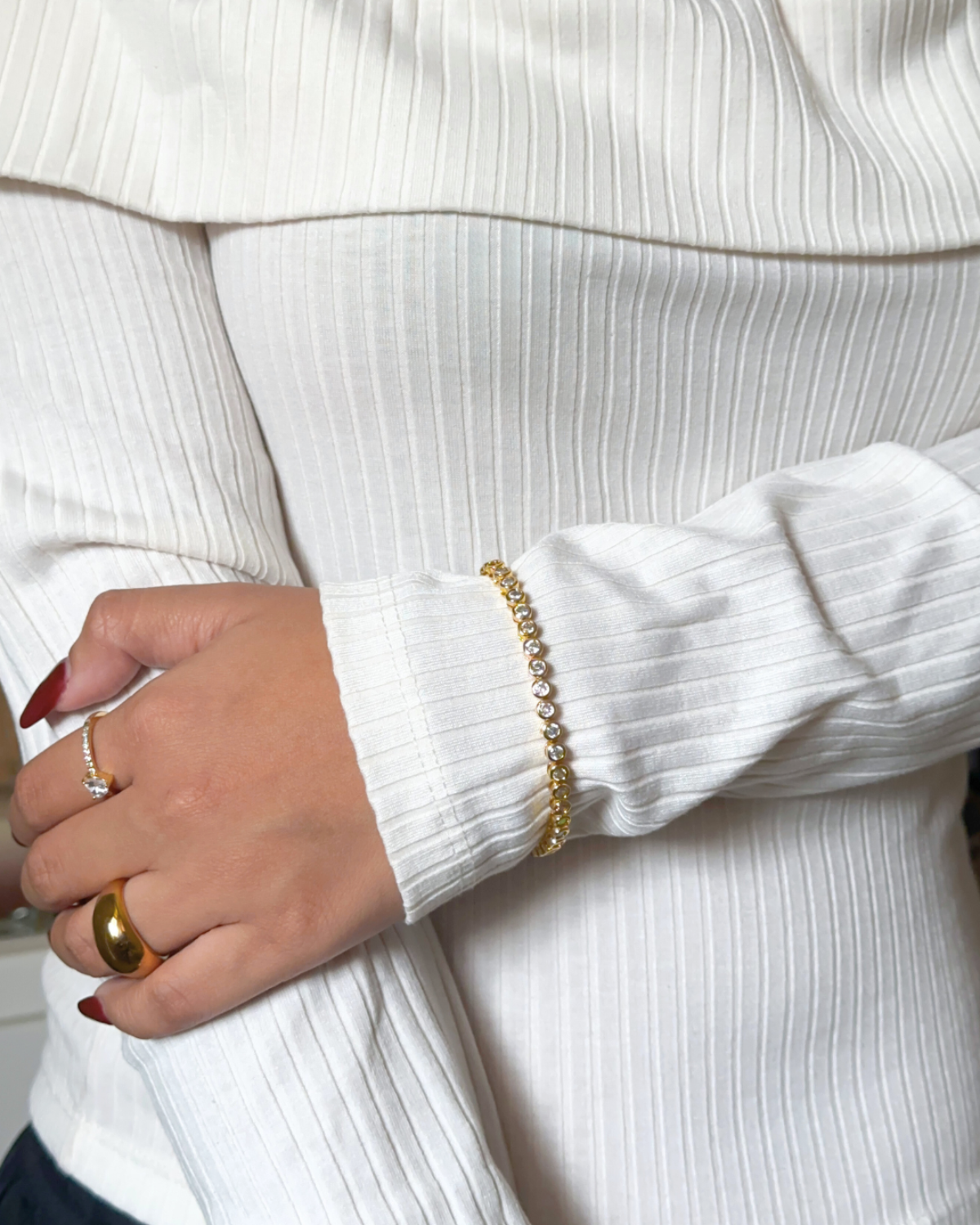 Model styling Mira Bracelet with a minimalist outfit for a chic everyday look.