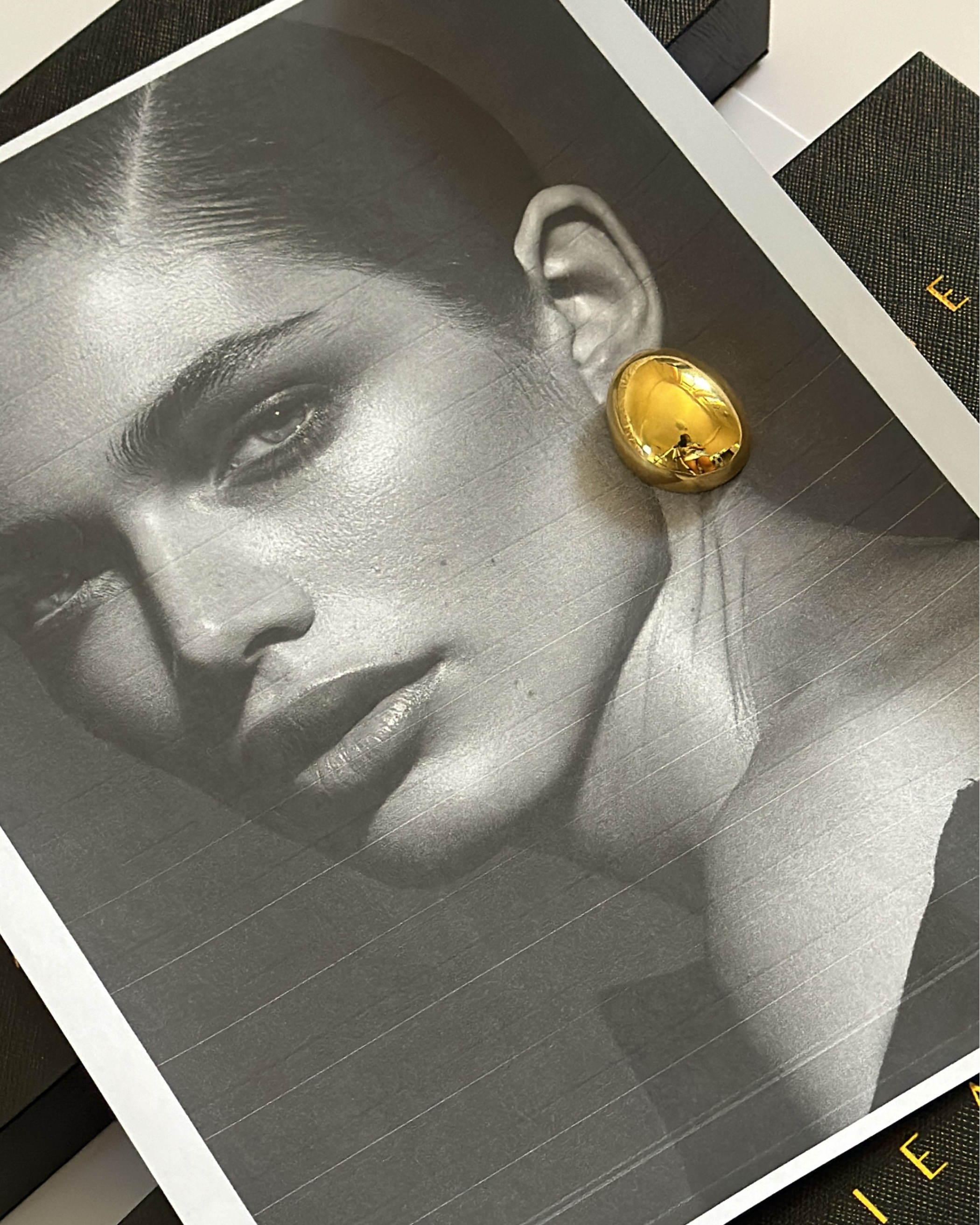 Mona Gold Earrings worn by model, highlighting bold drop shape and size.