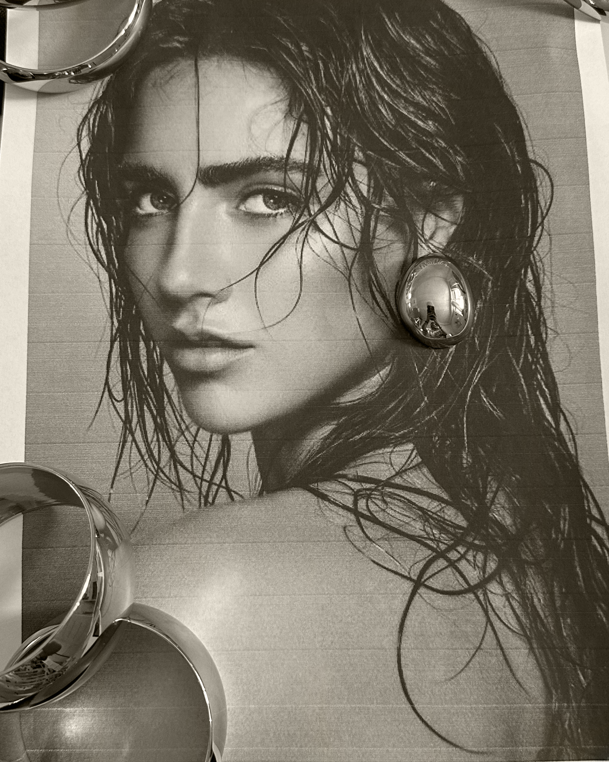 Mona Earrings styled with sleek hair for a sophisticated, bold look.