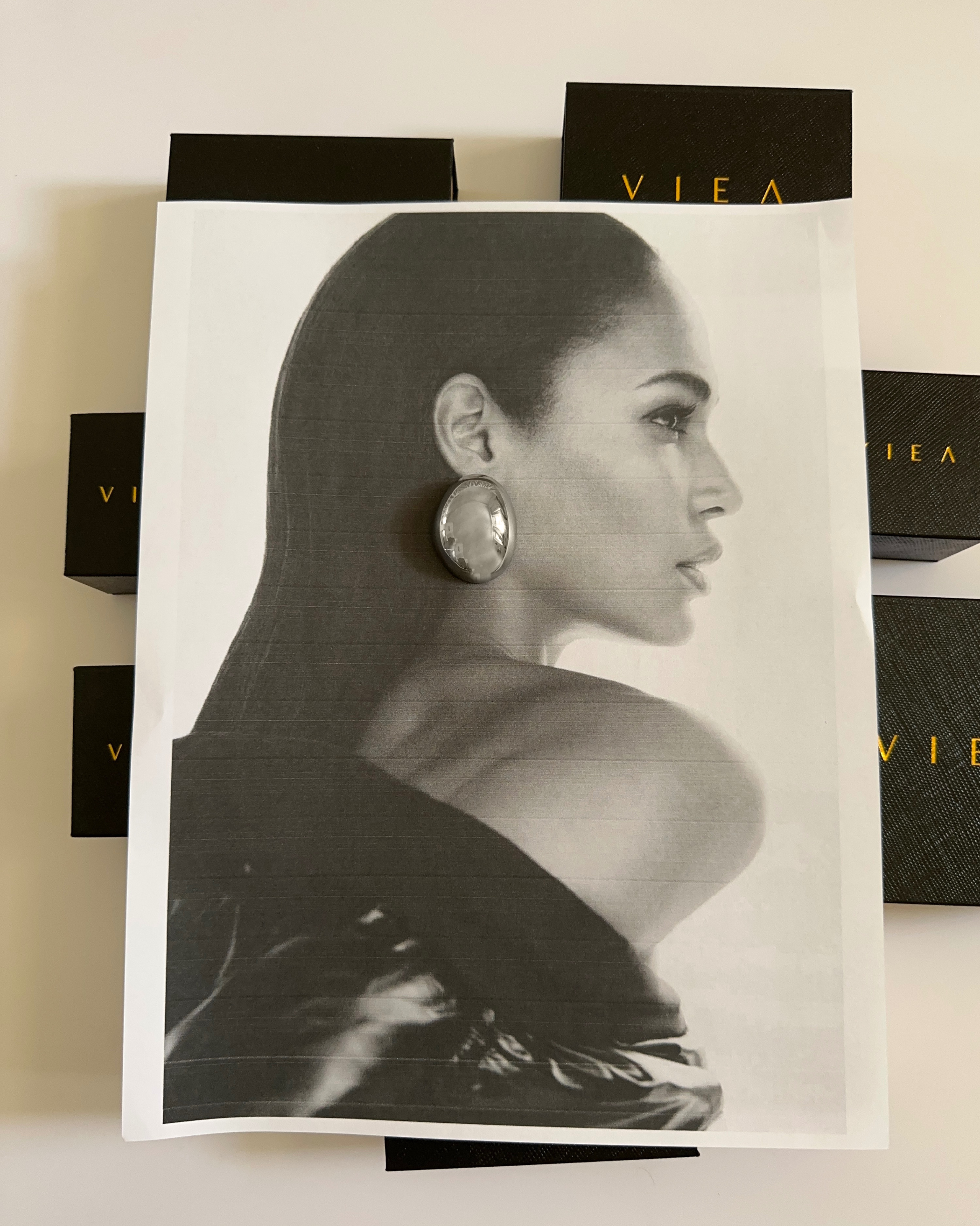 Front view of Mona Silver Earrings worn with minimalist outfit.