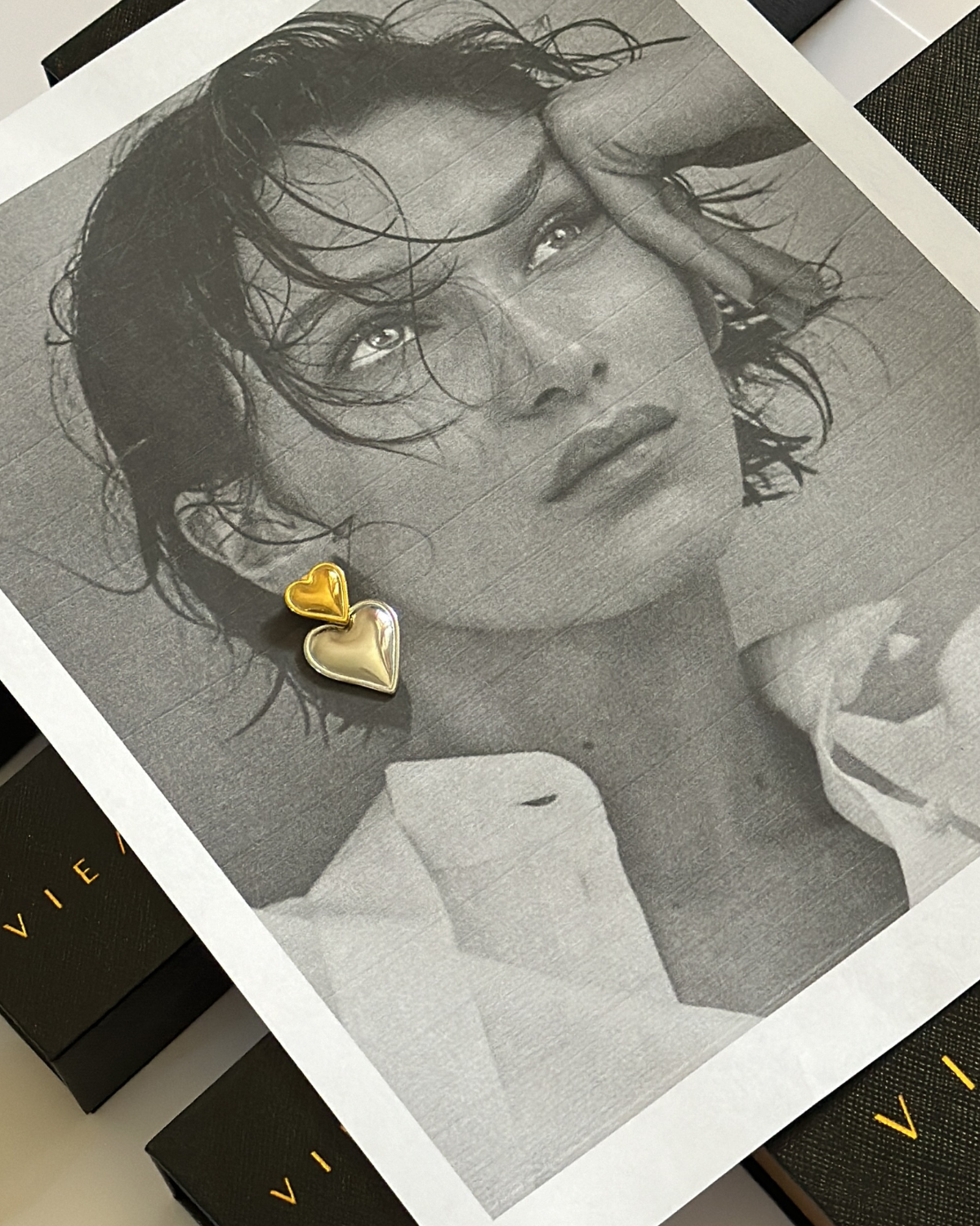 Elegant gold and silver Sadie Earrings styled for a romantic evening look.