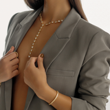 Zara Bracelet stacked with other gold pieces for a bold, modern wrist stack.