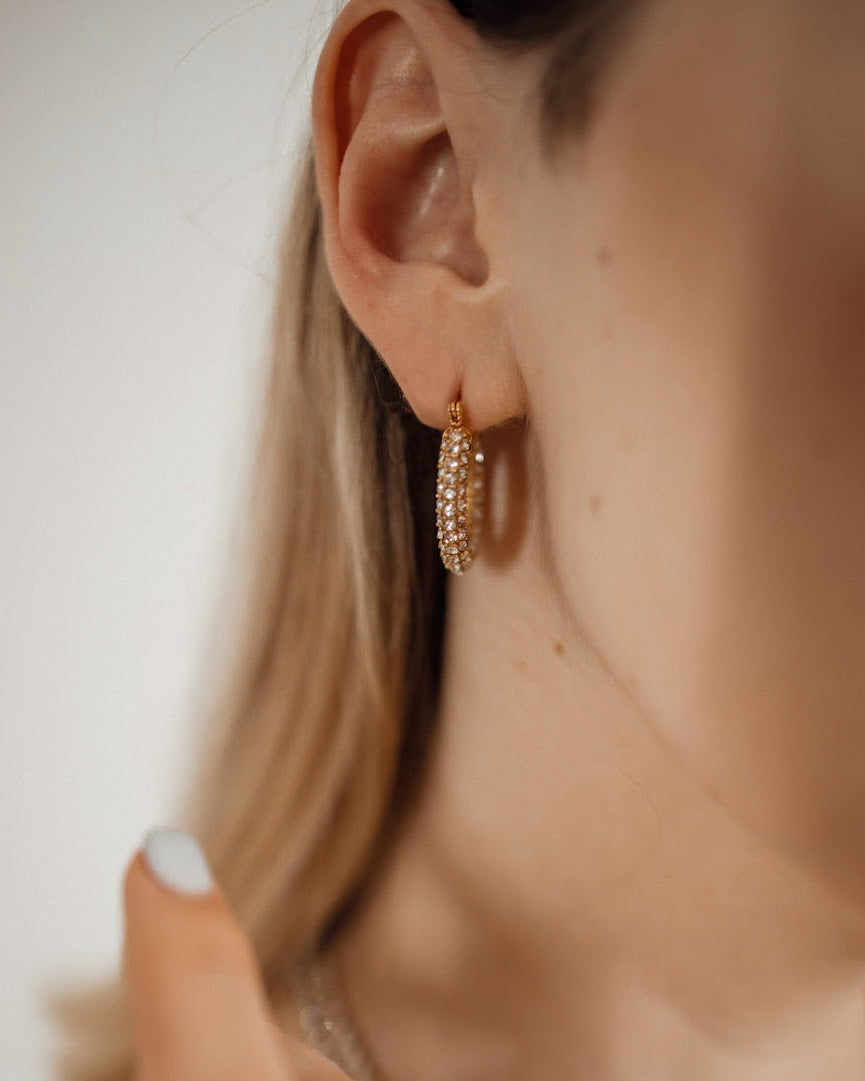 Closeup of Ayla Earrings worn, highlighting sparkling zirconia.