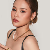 Side profile closeup of Blanche Necklace featuring freshwater pearls and curb chain contrast.