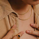 Damian gold rope chain necklace styled in a closeup view—refined and versatile.
