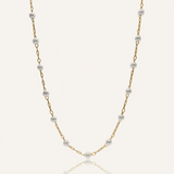Flatlay image of the Layla Necklace showing alternating pearl beads and gold oval chain links.