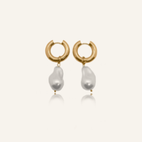 Flatlay image of Maya Earrings featuring gold hoops and baroque-style pearls.