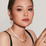 Another portrait of Maya Earrings worn with detachable pearl styled for impact.