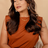 Portrait of model wearing the Tawnie Necklace styled with a classic outfit.