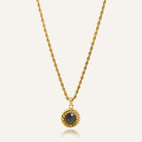 Valeriana Necklace product flatlay featuring gold rope chain and onyx pendant.