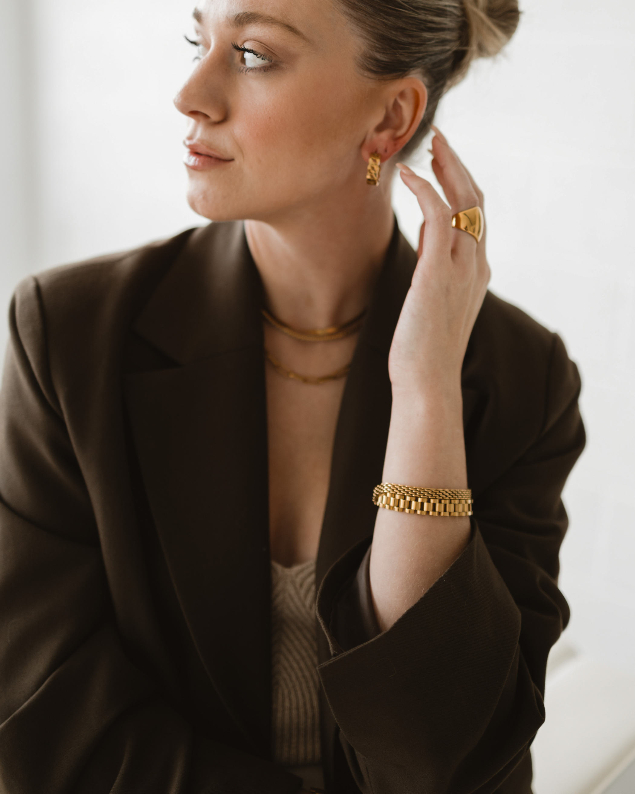 Model wearing the Zain Watchband in a half-body pose with minimal styling.