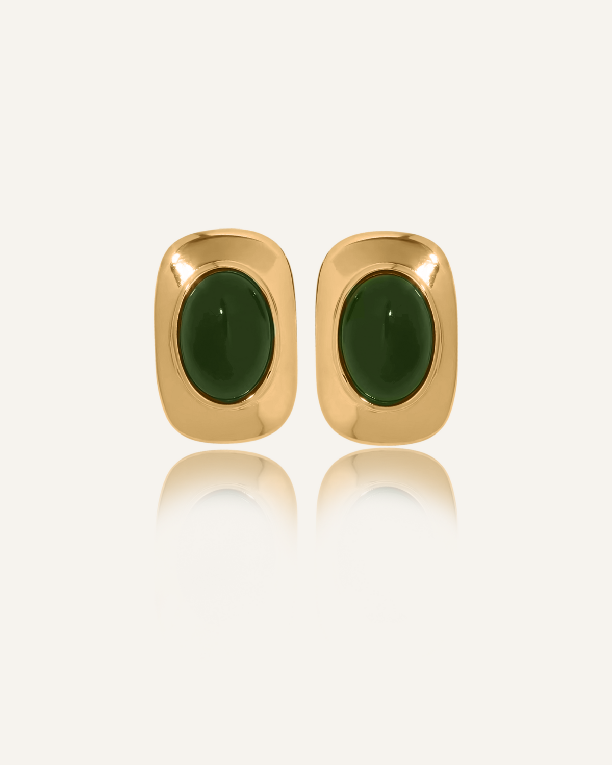 Flat lay of Aina Earrings featuring 18k gold coating and deep green opal stones.
