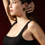 Model wearing Aina Earrings showing drop length and sculptural silhouette.