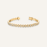 Andra Bracelet flatlay in 18K gold with octagonal zirconia stones and tennis chain design.