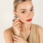 Model styled with Asha Earrings in silver for a complete elegant and tropical-inspired look.