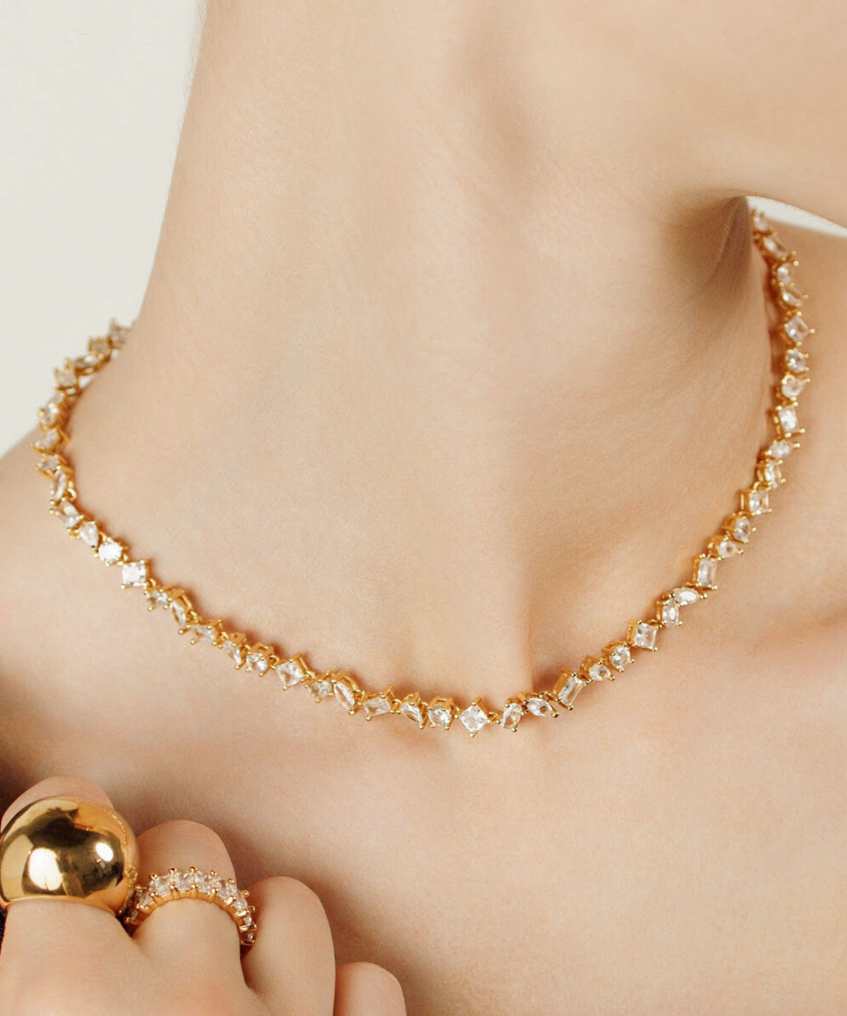 Closeup of Carina Necklace worn, showcasing its sparkling zirconia detail.