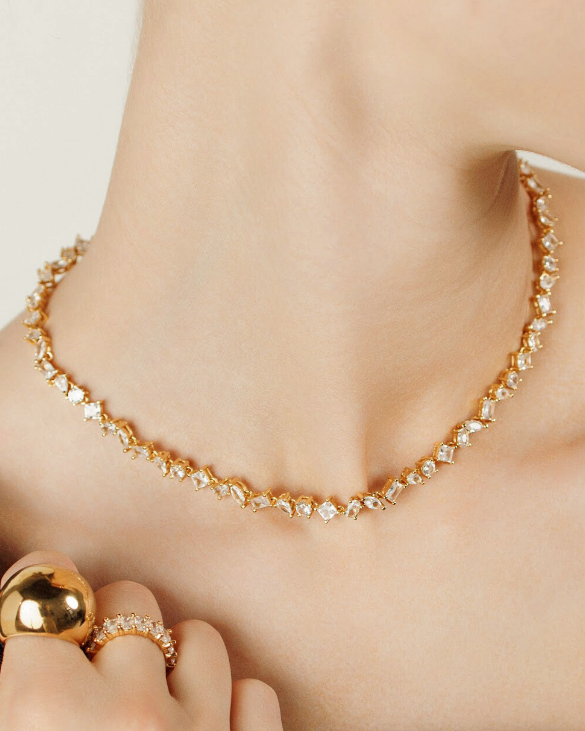Closeup of Carina Necklace worn, showcasing its sparkling zirconia detail.