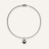 Casie Necklace in silver featuring a round snake chain with a bold circular dome pendant.