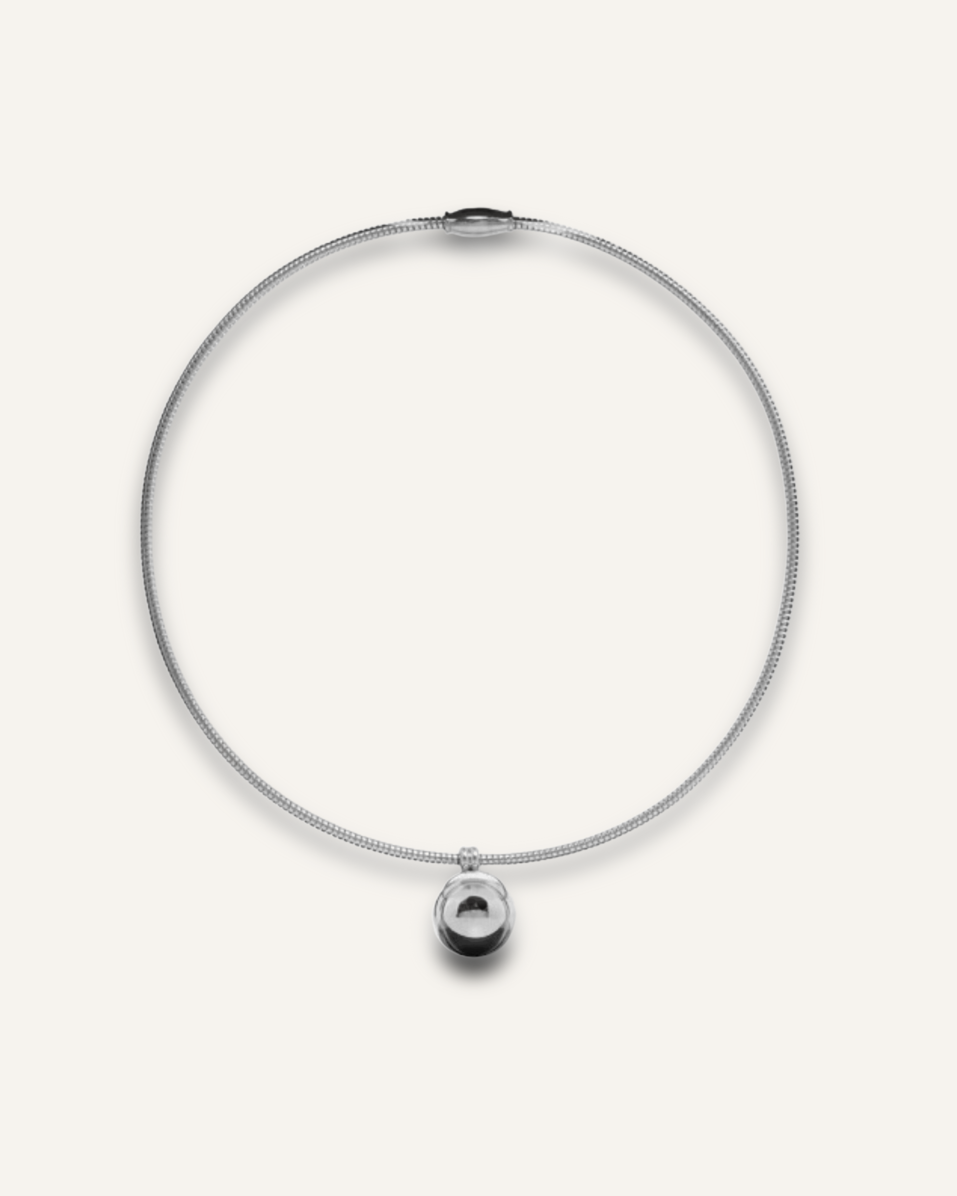 Casie Necklace in silver featuring a round snake chain with a bold circular dome pendant.