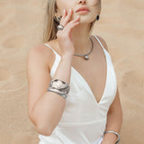 Casie Necklace styled for an elegant look, showcasing its shiny silver finish and pendant.