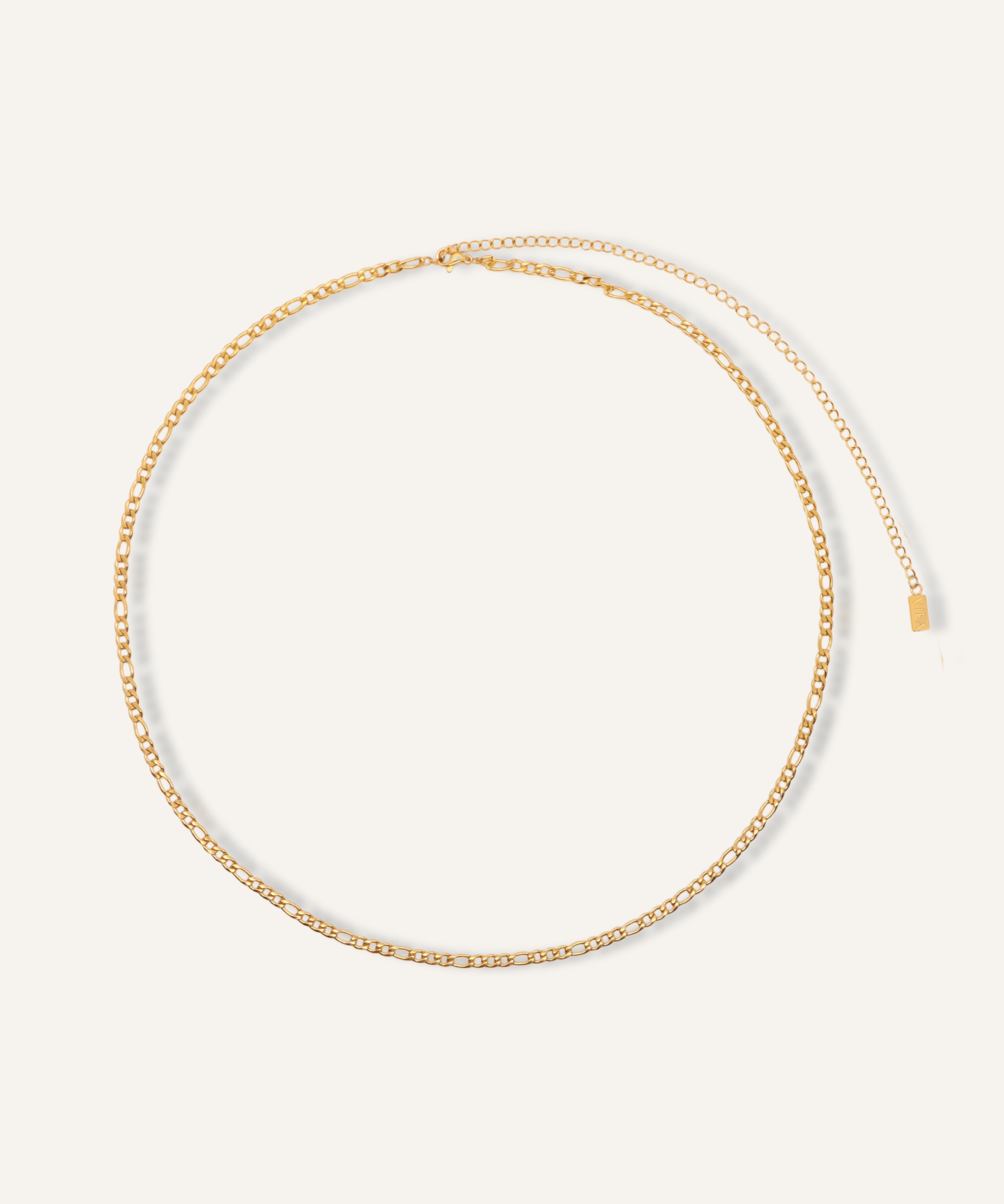 Flatlay image of the Caspian Body Chain showing its 18k gold-coated Figaro chain.