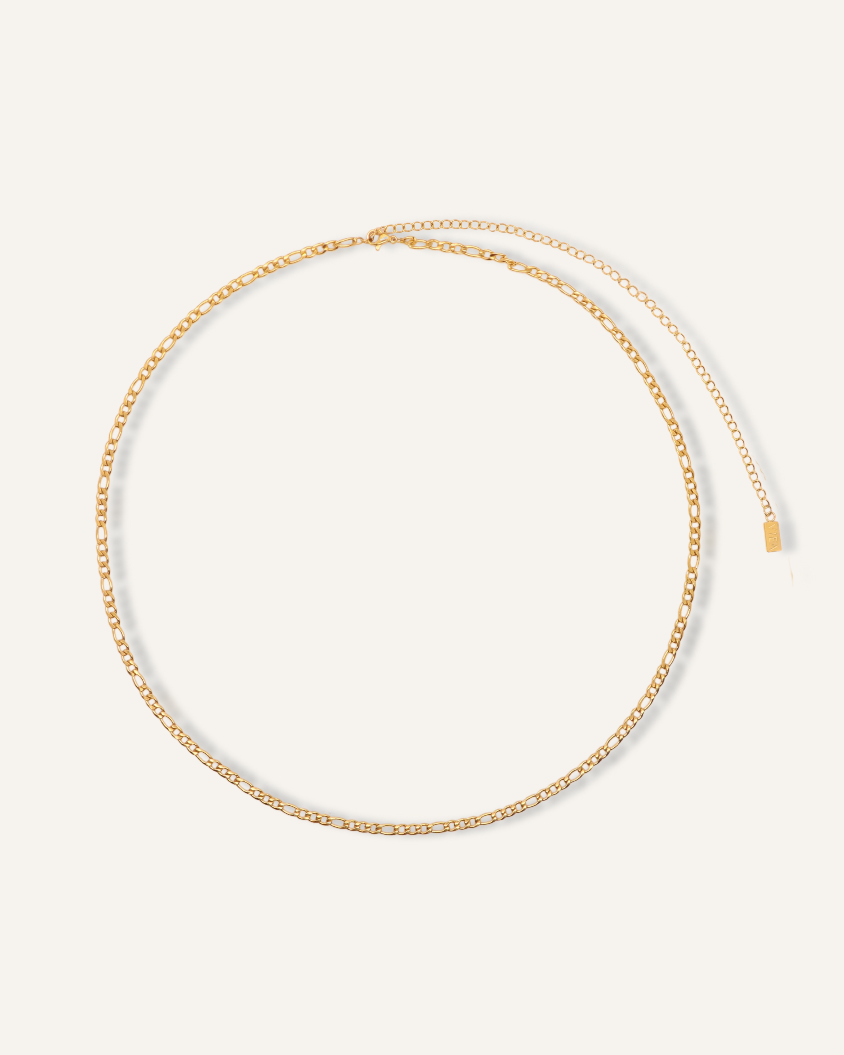 Flatlay image of the Caspian Body Chain showing its 18k gold-coated Figaro chain.