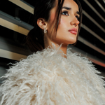 Claire gold earrings worn on model showcasing bold geometric huggie hoop design with cubic zirconia.