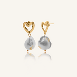 Freya heart-shaped gold earrings with unique baroque pearl and gold flaking.