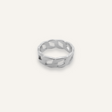 Kalani Ring in silver with Cuban link chain design laid flat to show texture and width.