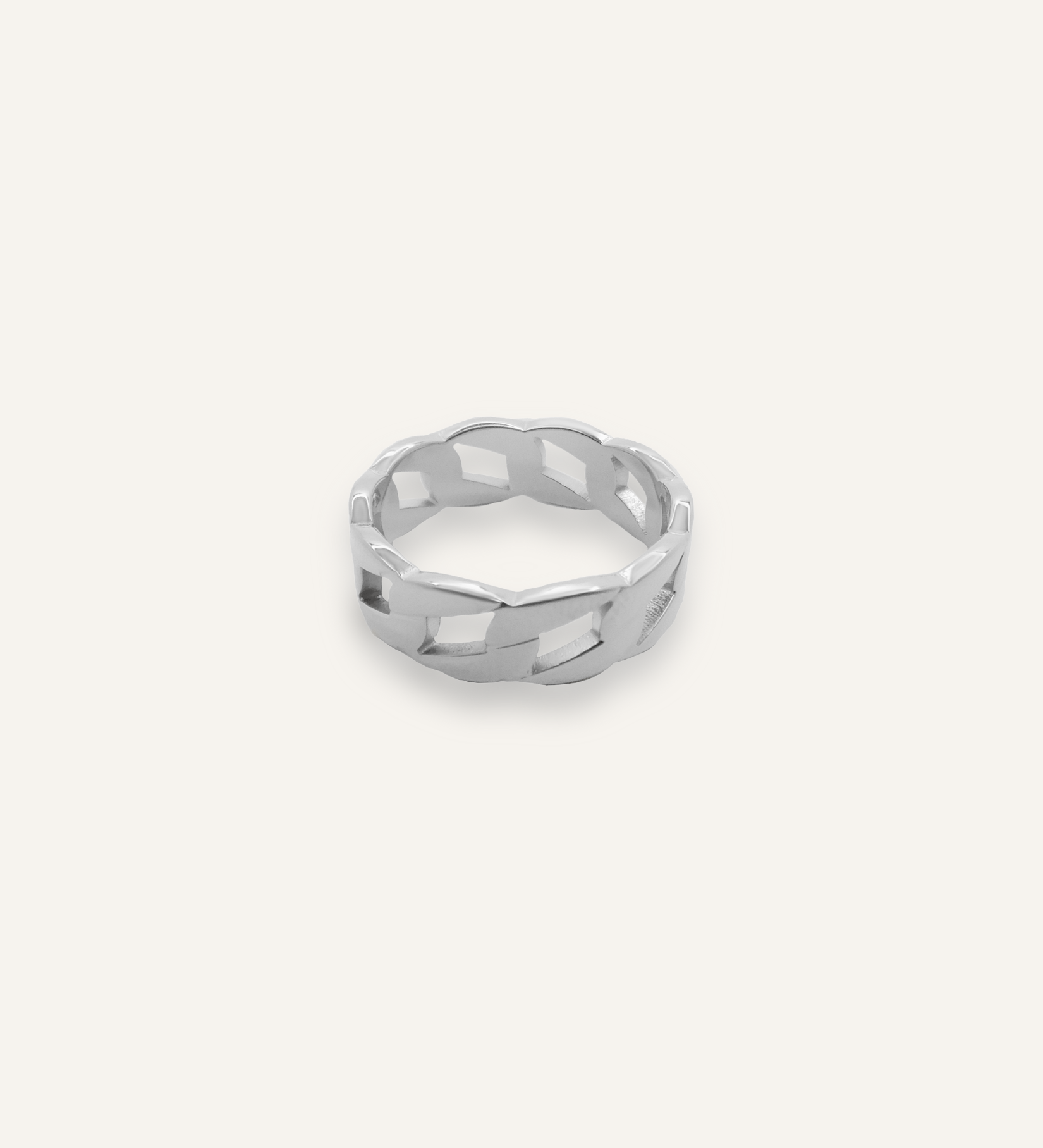 Kalani Ring in silver with Cuban link chain design laid flat to show texture and width.