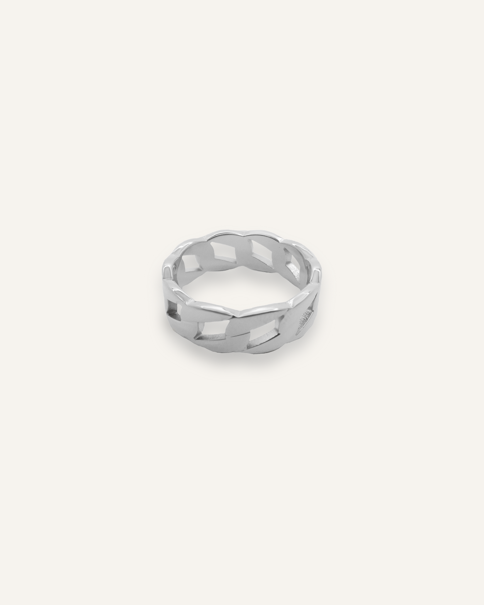 Kalani Ring in silver with Cuban link chain design laid flat to show texture and width.