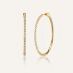 Lana gold hoop earrings with zirconia stones in a sleek, minimalist design.