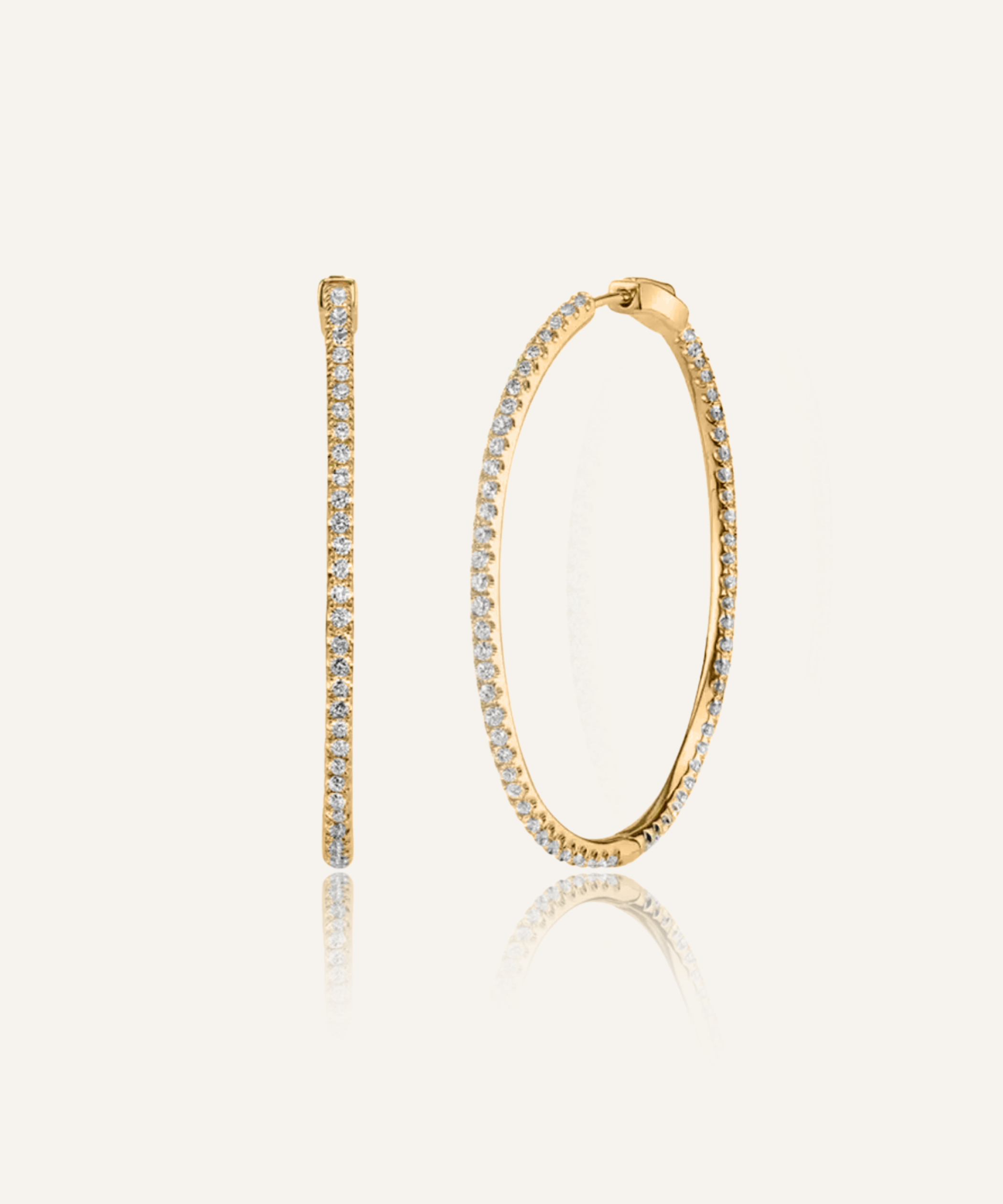 Lana gold hoop earrings with zirconia stones in a sleek, minimalist design.