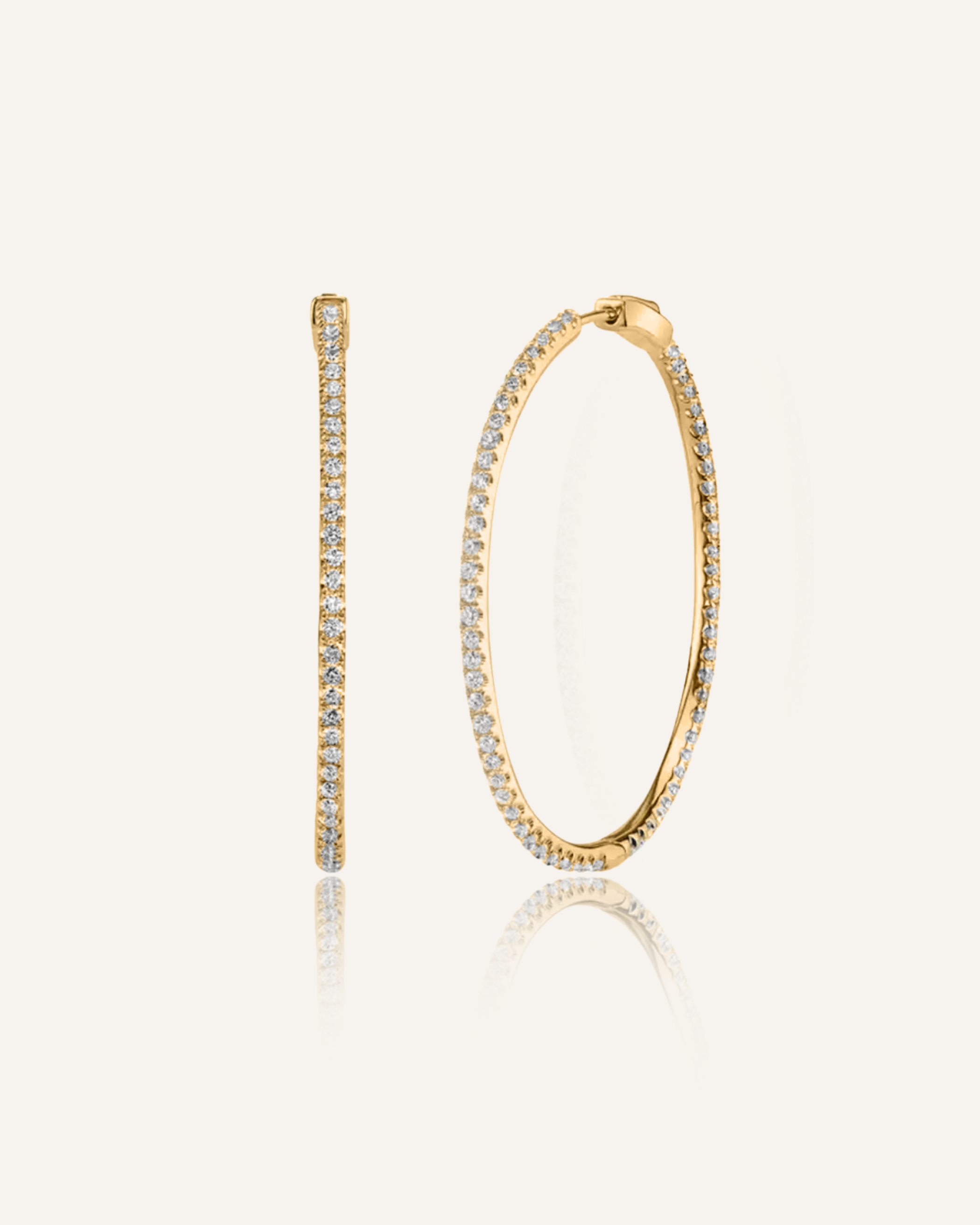 Lana gold hoop earrings with zirconia stones in a sleek, minimalist design.