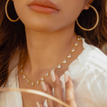Lana gold hoop earrings styled for subtle elegance.