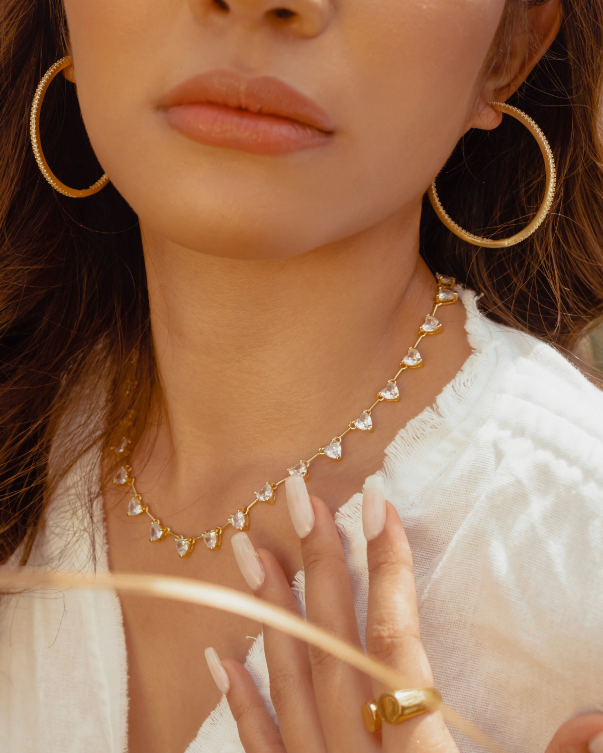 Lana gold hoop earrings styled for subtle elegance.