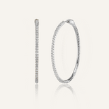 Lana silver hoop earrings with zirconia detail and huggie closure.
