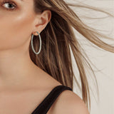 Model wearing Lana silver earrings for a chic daily look.