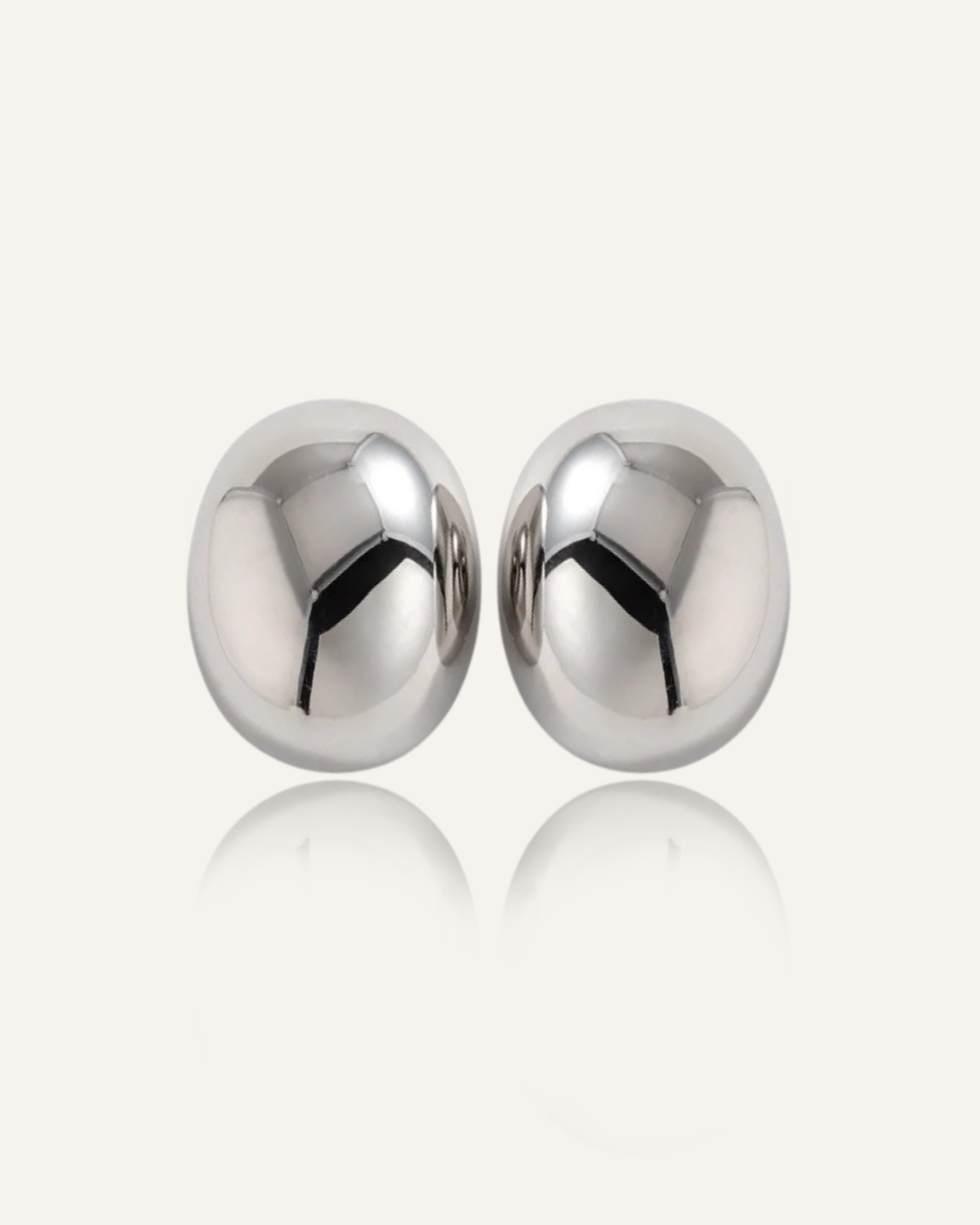 Leigh Earrings in silver with a bold dome shape and smooth, high-shine finish.